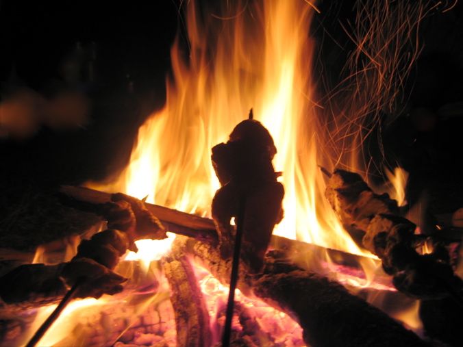 Cooking food over the camp fire